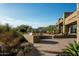Expansive backyard featuring a desert landscape, outdoor seating, and spectacular architecture at 41688 N 111Th Pl, Scottsdale, AZ 85262