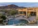 Desert landscaping surrounds the pool and backyard area with mountain views at 41688 N 111Th Pl, Scottsdale, AZ 85262