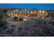 Expansive home featuring a backyard pool, patio, and desert landscaping at 41688 N 111Th Pl, Scottsdale, AZ 85262