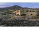 Expansive home featuring a backyard pool, patio, and desert landscaping at 41688 N 111Th Pl, Scottsdale, AZ 85262