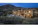 Expansive home featuring a backyard pool, patio, and desert landscaping at 41688 N 111Th Pl, Scottsdale, AZ 85262