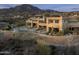 Expansive home featuring a backyard pool, patio, and desert landscaping at 41688 N 111Th Pl, Scottsdale, AZ 85262