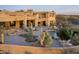 An aerial view of an expansive backyard with pool, patio, desert landscaping, and a mountain backdrop at 41688 N 111Th Pl, Scottsdale, AZ 85262