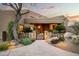 Inviting front entrance with custom door, desert plants, and stone accents at 41688 N 111Th Pl, Scottsdale, AZ 85262