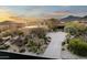 Home exterior featuring desert landscaping and a long driveway at 41688 N 111Th Pl, Scottsdale, AZ 85262