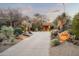 Beautiful home exterior with desert landscaping and a long driveway at 41688 N 111Th Pl, Scottsdale, AZ 85262