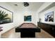 Spacious game room with a pool table, custom lighting, and desert views at 41688 N 111Th Pl, Scottsdale, AZ 85262