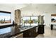 Modern kitchen featuring granite countertops, stainless steel appliances, and scenic desert views at 41688 N 111Th Pl, Scottsdale, AZ 85262