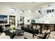 Bright open living room with modern furnishings, sleek wet bar, and soaring high ceilings at 41688 N 111Th Pl, Scottsdale, AZ 85262