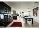 Open-concept living space with a gourmet kitchen, dining area, and comfortable seating at 41688 N 111Th Pl, Scottsdale, AZ 85262
