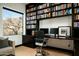 Close up of home office area featuring a large window and built in book shelves at 41688 N 111Th Pl, Scottsdale, AZ 85262