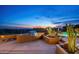 Outdoor kitchen with desert views featuring a stainless steel grill in a beautifully landscaped yard at 41688 N 111Th Pl, Scottsdale, AZ 85262