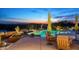 Backyard oasis featuring a lagoon-style pool and spa with lush landscaping and sunset views at 41688 N 111Th Pl, Scottsdale, AZ 85262
