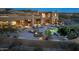 A stunning outdoor living area features a gorgeous pool, firepit, and desert landscaping at 41688 N 111Th Pl, Scottsdale, AZ 85262