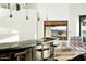 Beautiful modern wet bar featuring elegant pendant lighting and beautiful backyard views at 41688 N 111Th Pl, Scottsdale, AZ 85262