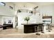 Unique wet bar with seating and architectural staircase, with views to the pool table room at 41688 N 111Th Pl, Scottsdale, AZ 85262
