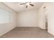 Bedroom with carpet flooring, ceiling fan and window allowing natural light at 4548 E Libby St, Phoenix, AZ 85032