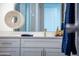 Bathroom vanity features quartz countertop, white cabinets, brushed nickel faucet, and stylish decor accents at 470 S Soho Ln # 1, Chandler, AZ 85225