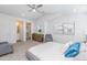 Bright bedroom with a ceiling fan, ensuite bathroom and a chair at 470 S Soho Ln # 1, Chandler, AZ 85225