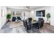 Open-concept dining and living area with modern furnishings, natural light, and elegant décor, perfect for entertaining and relaxation at 470 S Soho Ln # 1, Chandler, AZ 85225
