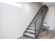 Modern staircase with iron railing and neutral carpet at 470 S Soho Ln # 1, Chandler, AZ 85225