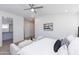 Bright bedroom featuring vaulted ceiling, neutral color scheme, and a walk-in closet at 482 S Soho Ln # 3, Chandler, AZ 85225