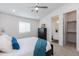 Cozy bedroom showcasing plush pillows, walk-in closet, an ensuite bathroom, and neutral color palette at 482 S Soho Ln # 3, Chandler, AZ 85225