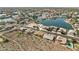 An aerial view shows a neighborhood surrounded by water features, including lakes, ponds, and rivers at 5310 W Melinda Ln, Glendale, AZ 85308