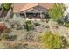 Aerial view of the desert backyard highlighting covered patio, pond feature and pergola covered area at 5310 W Melinda Ln, Glendale, AZ 85308