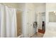 Bathroom featuring a bathtub with shower, storage and doorway to hallway at 5310 W Melinda Ln, Glendale, AZ 85308