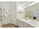 Well-lit bathroom with a double sink vanity and a glass-enclosed shower at 5310 W Melinda Ln, Glendale, AZ 85308