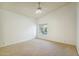 Bright bedroom features a ceiling fan and large window letting in natural light at 5310 W Melinda Ln, Glendale, AZ 85308