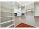 Spacious closet with wood floors and built-in storage shelves, well organized at 5310 W Melinda Ln, Glendale, AZ 85308