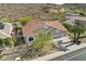 Well-maintained home featuring a tile roof, mature landscaping, a three-car garage, and a circular driveway at 5310 W Melinda Ln, Glendale, AZ 85308