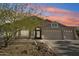 Charming single-story home with a three car garage and desert landscaping at 5310 W Melinda Ln, Glendale, AZ 85308