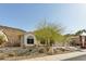 Attractive single-story home with desert landscaping, mature trees and a three-car garage at 5310 W Melinda Ln, Glendale, AZ 85308