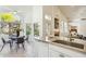 Bright kitchen with granite countertops, modern appliances, and a breakfast nook overlooking the garden at 5310 W Melinda Ln, Glendale, AZ 85308
