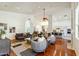 Spacious living room boasting an open floorplan, hardwood floors, and ample natural light at 5310 W Melinda Ln, Glendale, AZ 85308