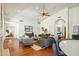 Spacious living room featuring hardwood floors, neutral furniture, vaulted ceiling and large windows at 5310 W Melinda Ln, Glendale, AZ 85308