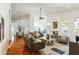 Open-concept space with hardwood floors, neutral decor, living room, dining area and kitchen at 5310 W Melinda Ln, Glendale, AZ 85308