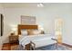 Serene main bedroom with a large window, ceiling fan, and ensuite bathroom access at 5310 W Melinda Ln, Glendale, AZ 85308