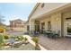 Covered patio features seating area, pond, and landscaped yard at 5310 W Melinda Ln, Glendale, AZ 85308