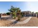 Backyard featuring gravel landscaping and a covered patio at 6129 S White Pl, Chandler, AZ 85249