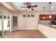 Cozy dining area adjacent to the kitchen, featuring a sliding glass door and modern lighting at 6129 S White Pl, Chandler, AZ 85249