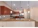 Beautiful kitchen with a central island, granite countertops, and stainless steel appliances at 6129 S White Pl, Chandler, AZ 85249