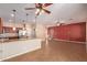 Open concept kitchen with stainless steel appliances, granite counters, and dark wood cabinetry at 6129 S White Pl, Chandler, AZ 85249