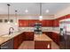 Well-equipped kitchen with stainless steel appliances and granite countertops for food preparation at 6129 S White Pl, Chandler, AZ 85249