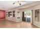 Spacious living room with large windows and a sliding glass door leading to the backyard at 6129 S White Pl, Chandler, AZ 85249