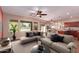 An open-concept living room with a comfortable sofa, neutral tones, and abundant natural light at 6129 S White Pl, Chandler, AZ 85249