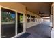 Covered patio featuring a brick floor and a ceiling fan at 6129 S White Pl, Chandler, AZ 85249